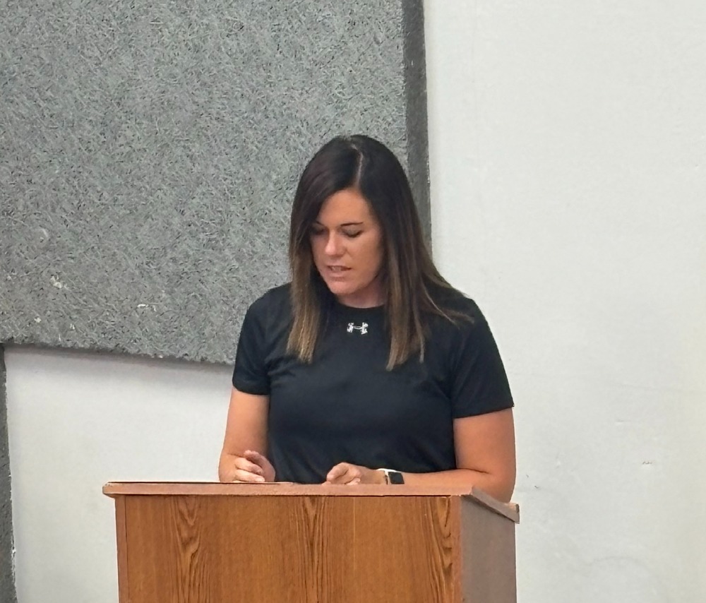 School Board President Julie Miller addresses the staff