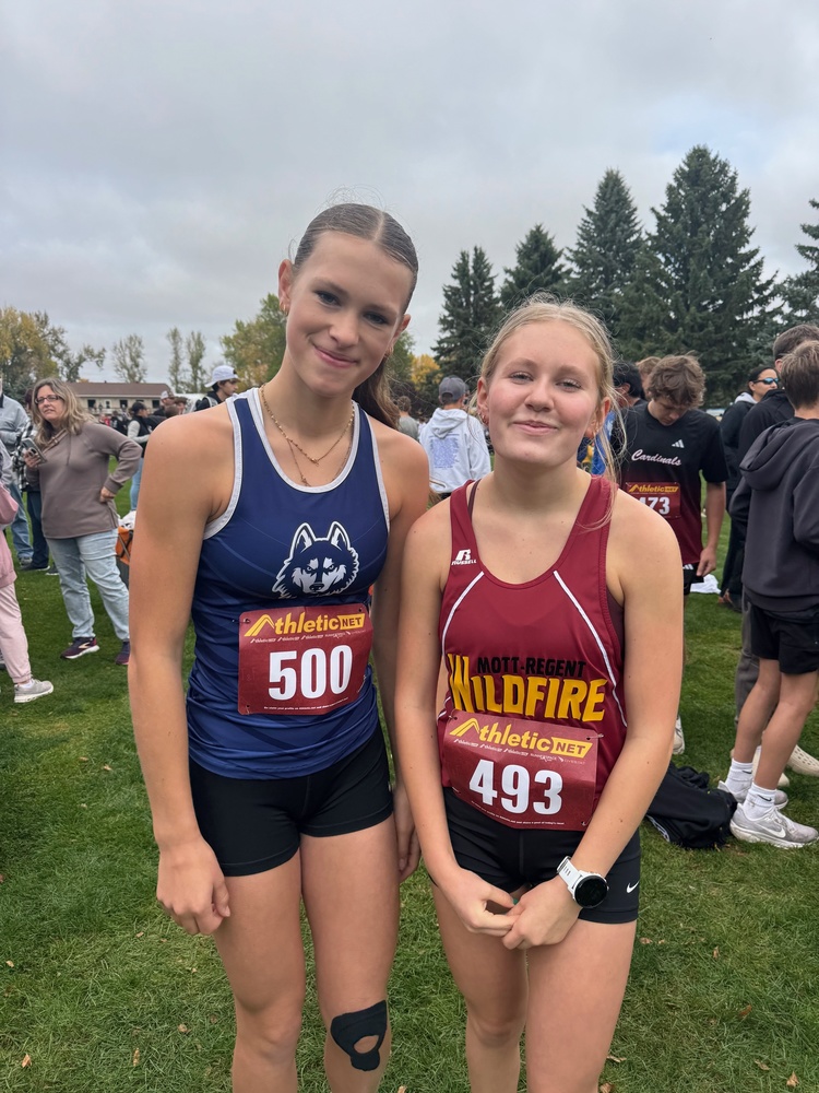 Kara Roll and Hannah Dinius at a Cross Country meet