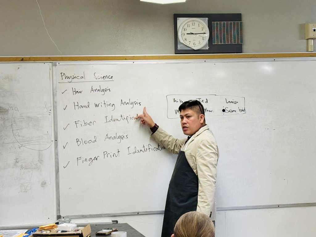 Mr. Alido leading the forensics lesson in Physical Science