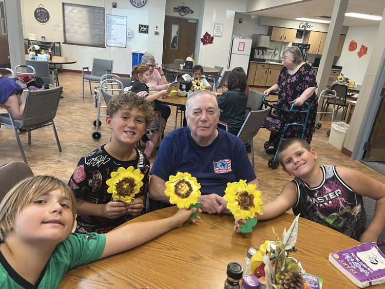 Third Graders did a Sunflower Art with the senior residents at the Mott Care Center. 🌻