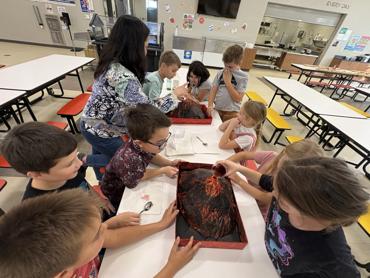 Mrs. Sison’s third-grade class created paper mache volcano art pieces and used them in a volcanic eruption experiment.