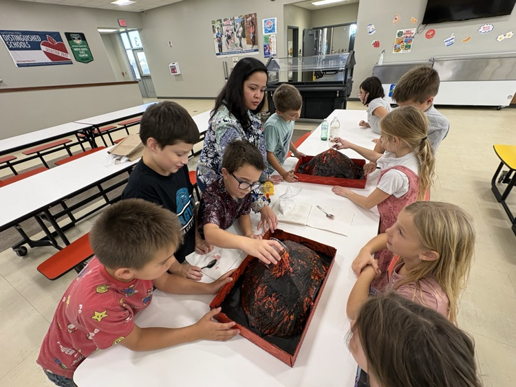 Mrs. Sison’s third-grade class created paper mache volcano art pieces and used them in a volcanic eruption experiment.