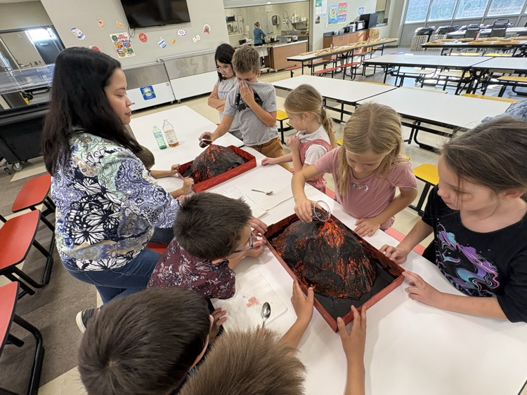 Mrs. Sison’s third-grade class created paper mache volcano art pieces and used them in a volcanic eruption experiment.