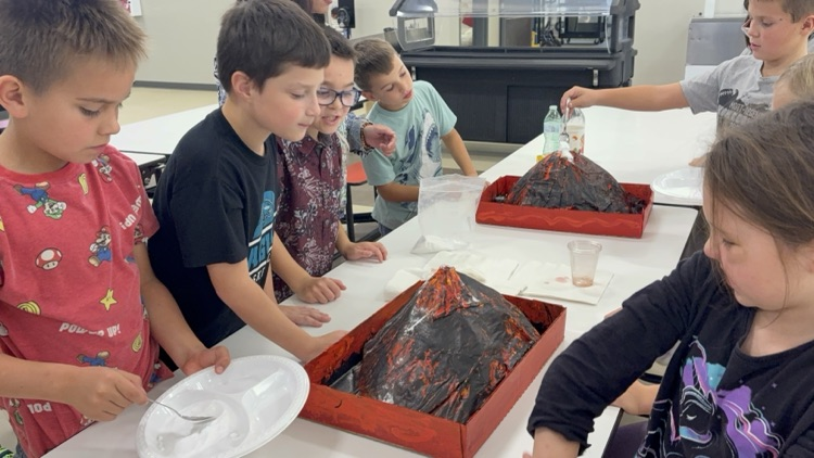 Mrs. Sison’s third-grade class created paper mache volcano art pieces and used them in a volcanic eruption experiment.