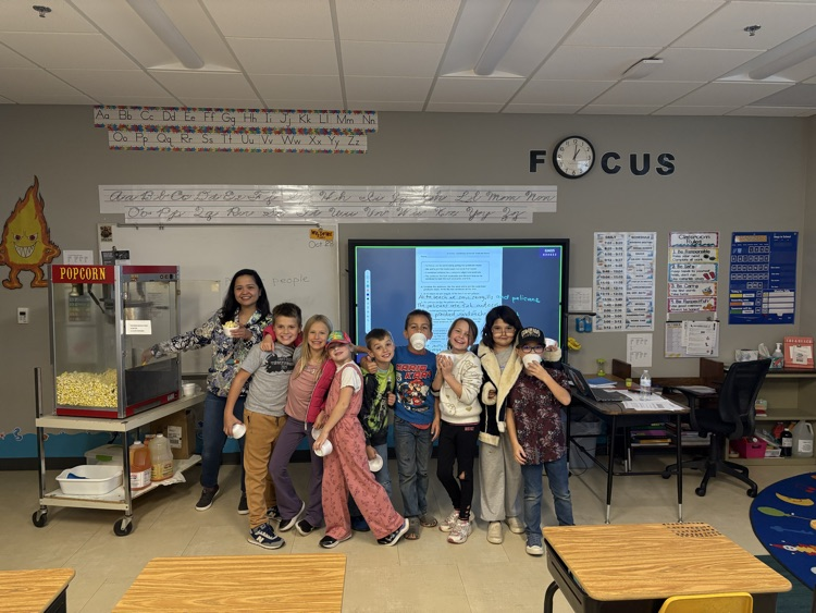 They celebrated with a popcorn party because they achieved their pompom goal!