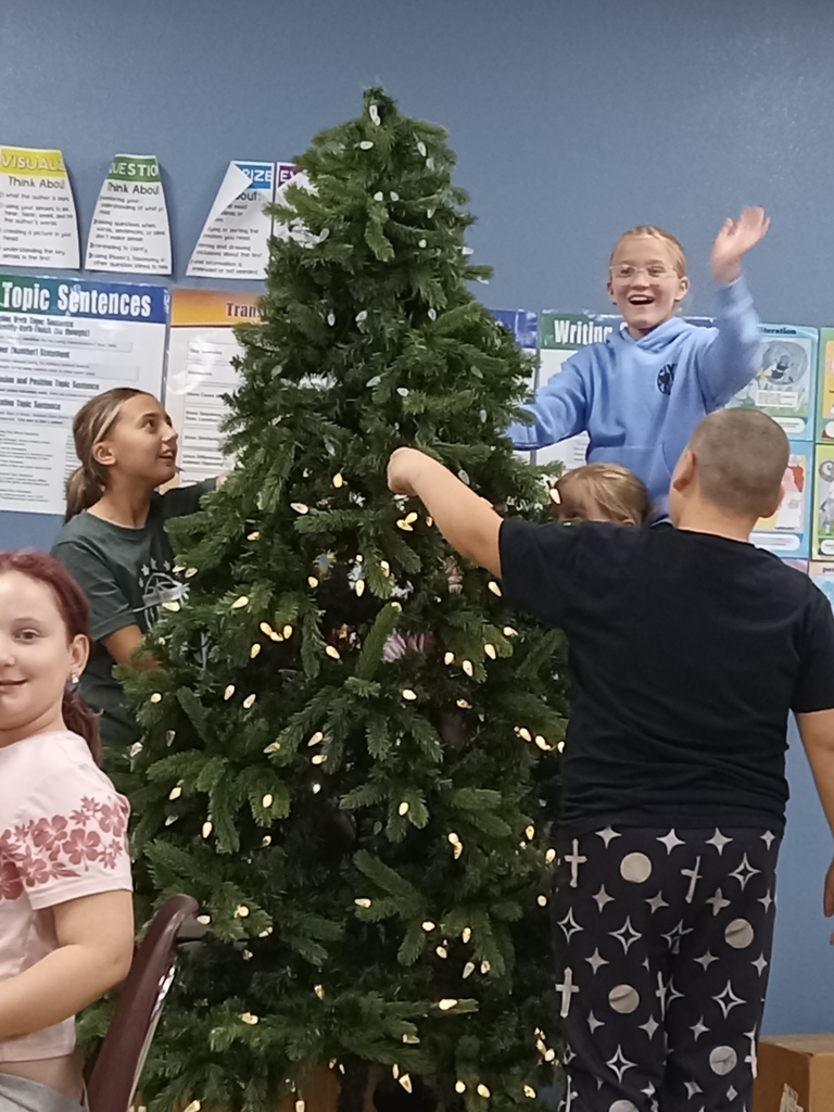 The 5th graders were excited to put up our Christmas tree today. A huge thank you to Amy Miller for the tree, a tree skirt, and decorations!