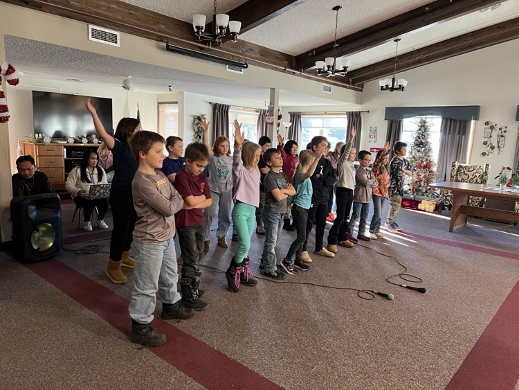 Third graders singing at The Mott Care Center.