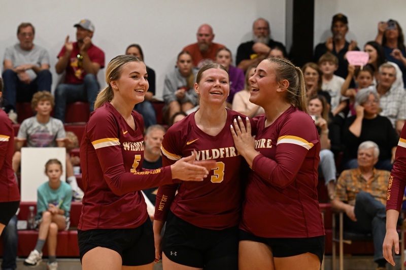 Emily with her teammates Jada Ottmar & Allison Grist celebrating her 1,000th assist