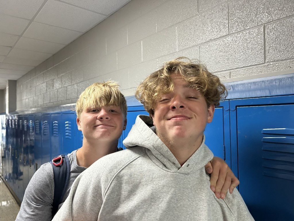 friends smiling at their locker