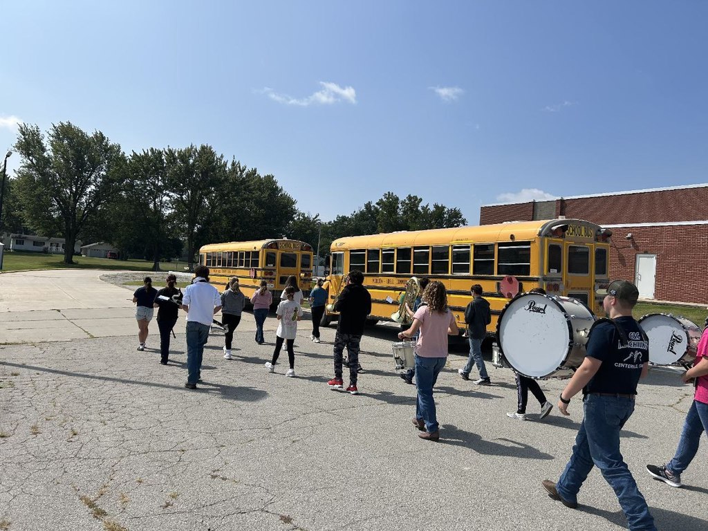 band lined up by the busses
