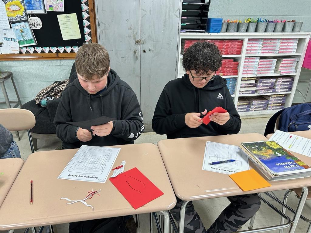 Students working on creating their topographic map models.