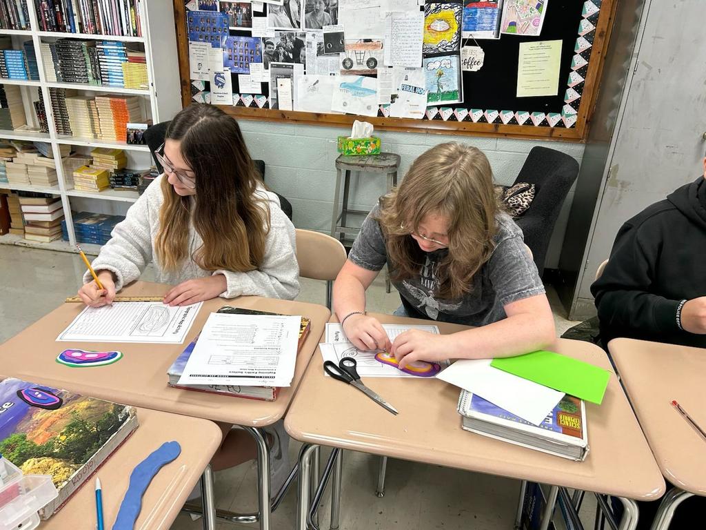 Students working on creating their topographic map models.