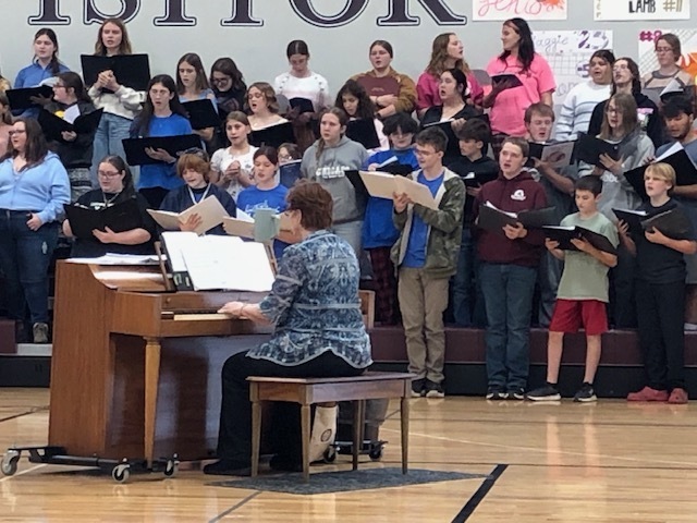 Moulton-Udell students rehearsing for the concert. Thiah Shepherd, Vivian McCollom and Luke Milner are rehearsing.