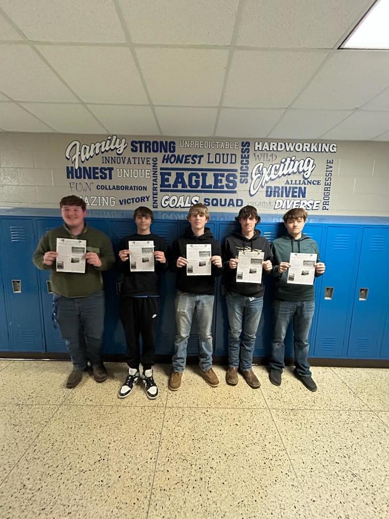 Students showing off the Talon Times