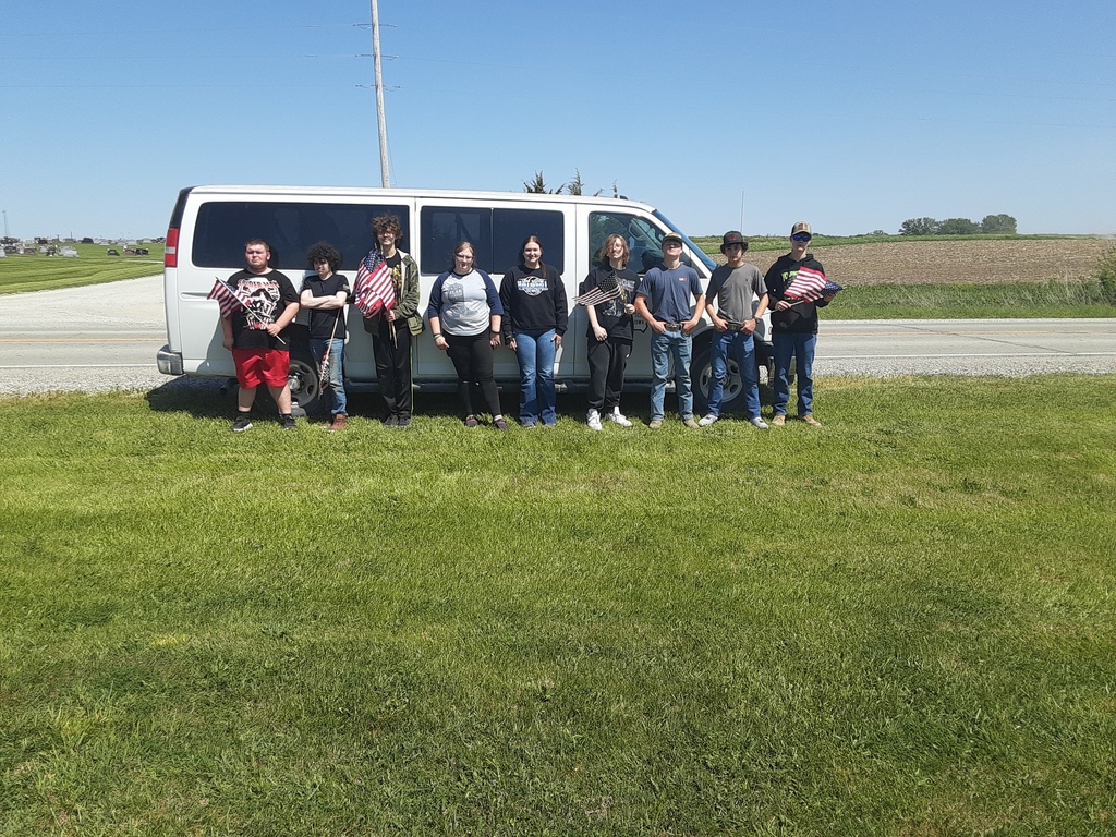 Moulton-Udell High School students doing their civic duty and good deed for the day by placing flags on veterans' graves at two cemeteries north of town on May 11th .