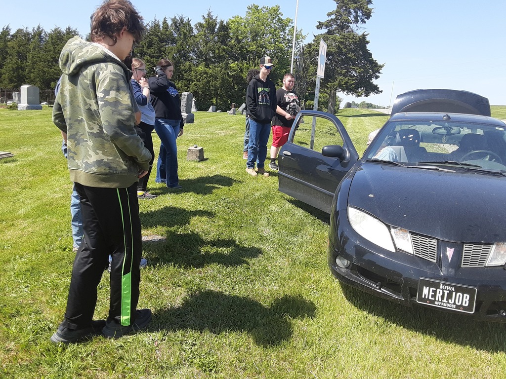 Moulton-Udell High School students doing their civic duty and good deed for the day by placing flags on veterans' graves at two cemeteries north of town on May 11th .