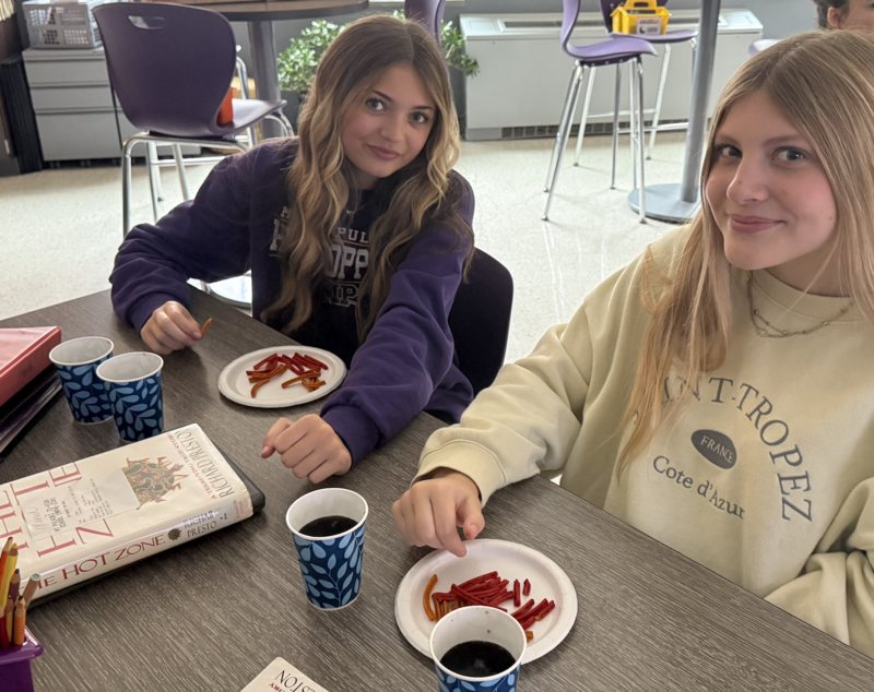 Two girls having snack