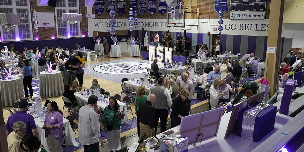 image of decorated gymnasium full of guests during event