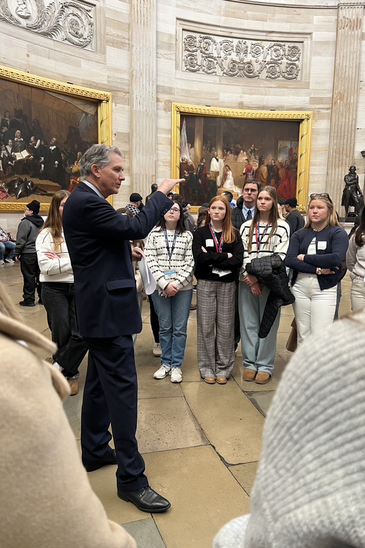 Congressman French Hill speaking to a group of students in the U.S. Capitol building