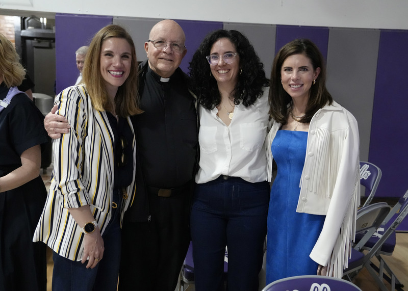 four event guests smiling for the camera