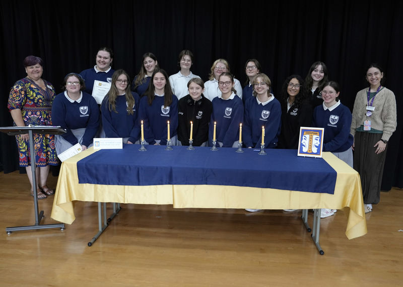 large group of students smiling at the camera