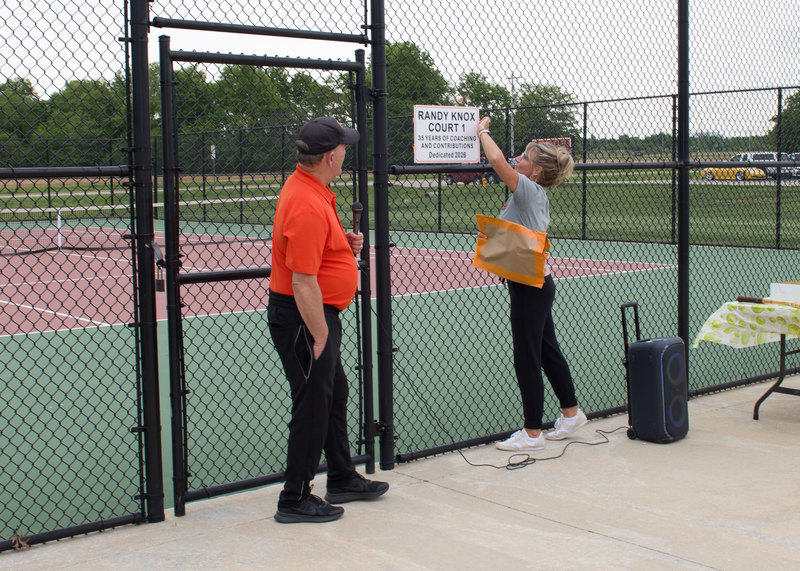 Coach Adams unveils the dedication sign.