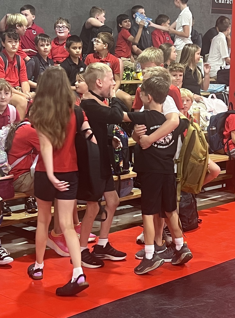 students hugging