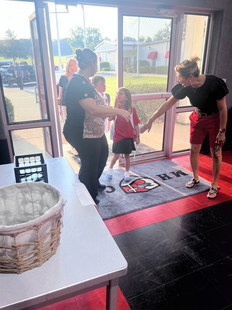 kids being greeted at the door