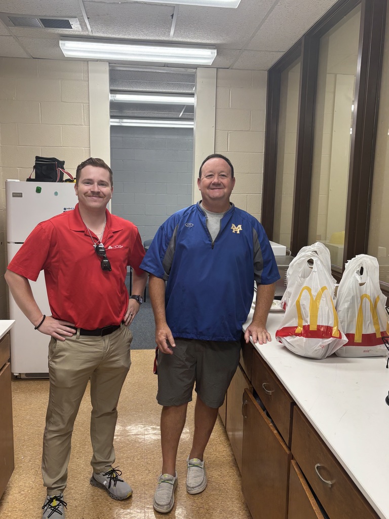 two guys with mcdonald's bags