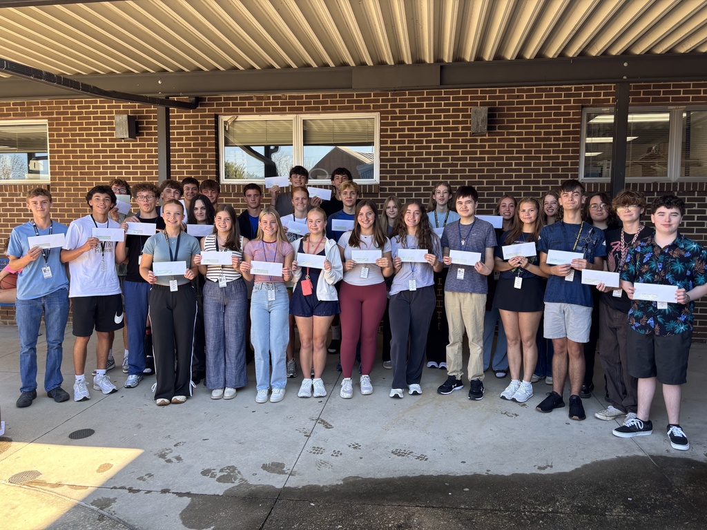 kids holding check