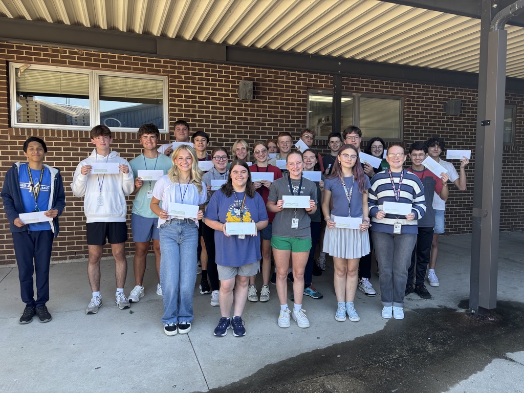 kids holding check