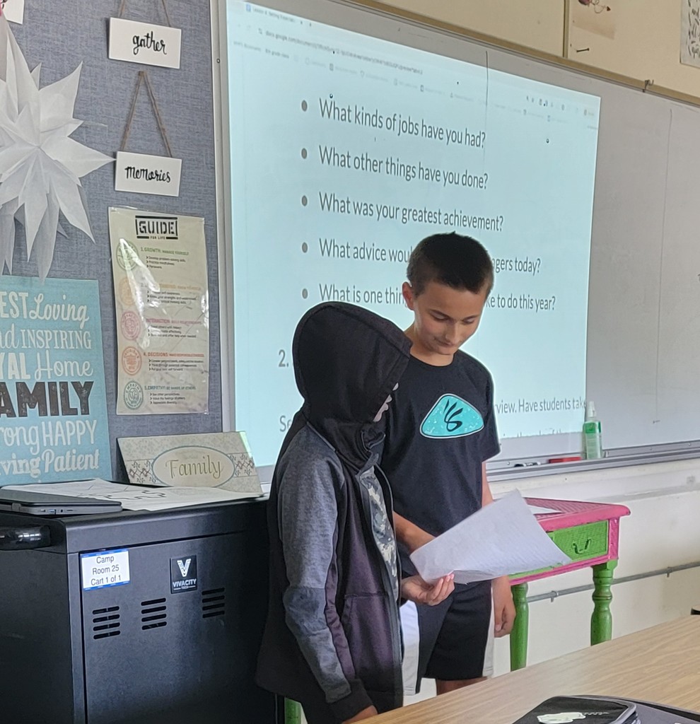 Two boys presenting in front of class