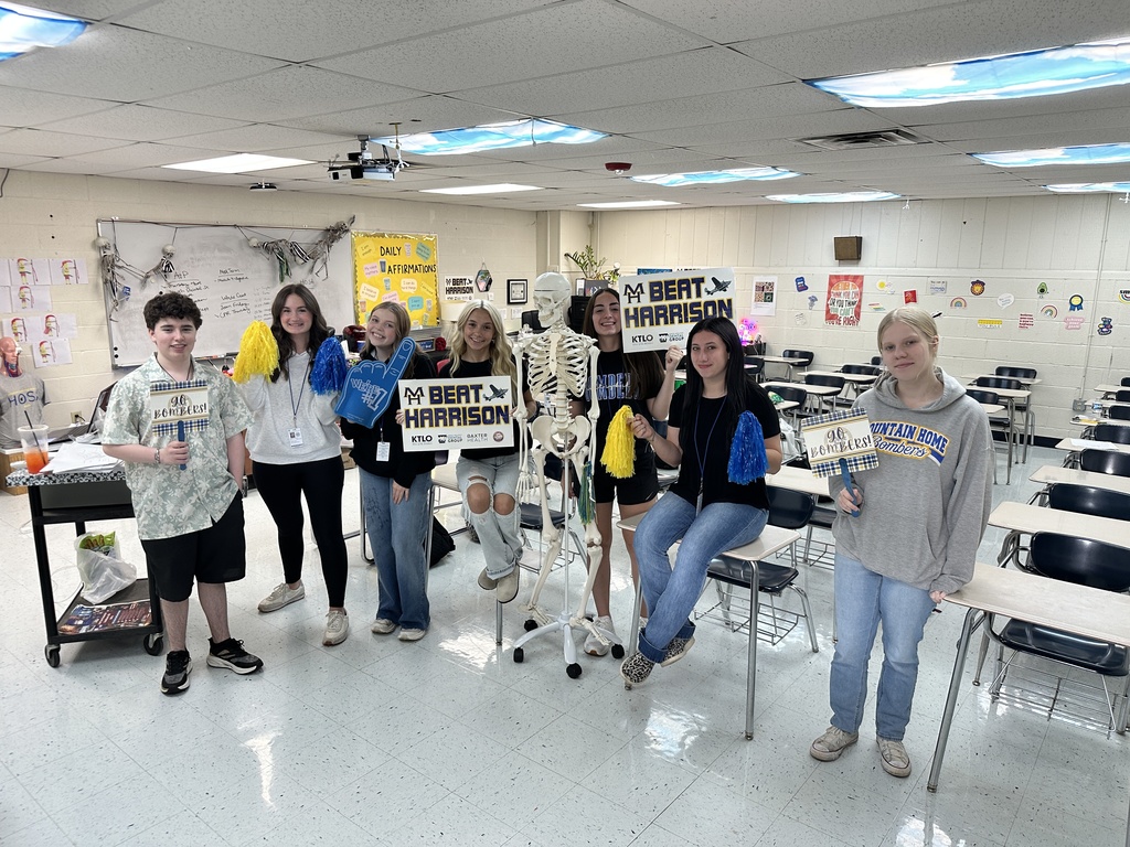 kids holding school spirit signs