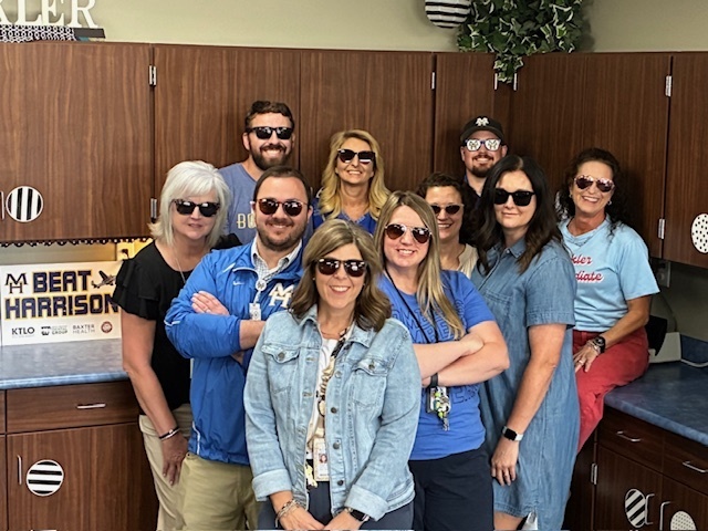 staff in sunglasses