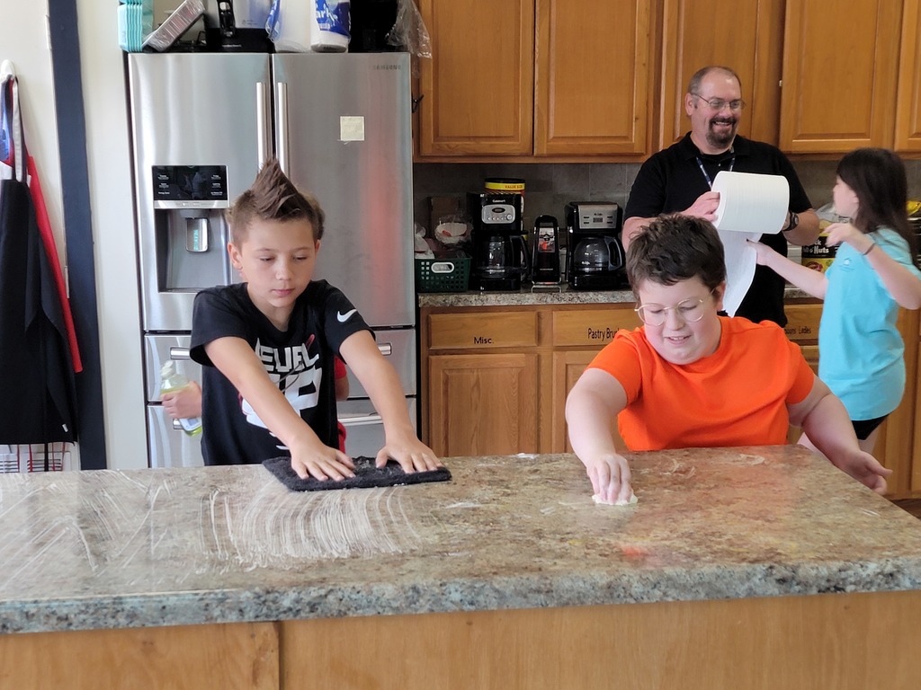 kids cleaning messy kitchen