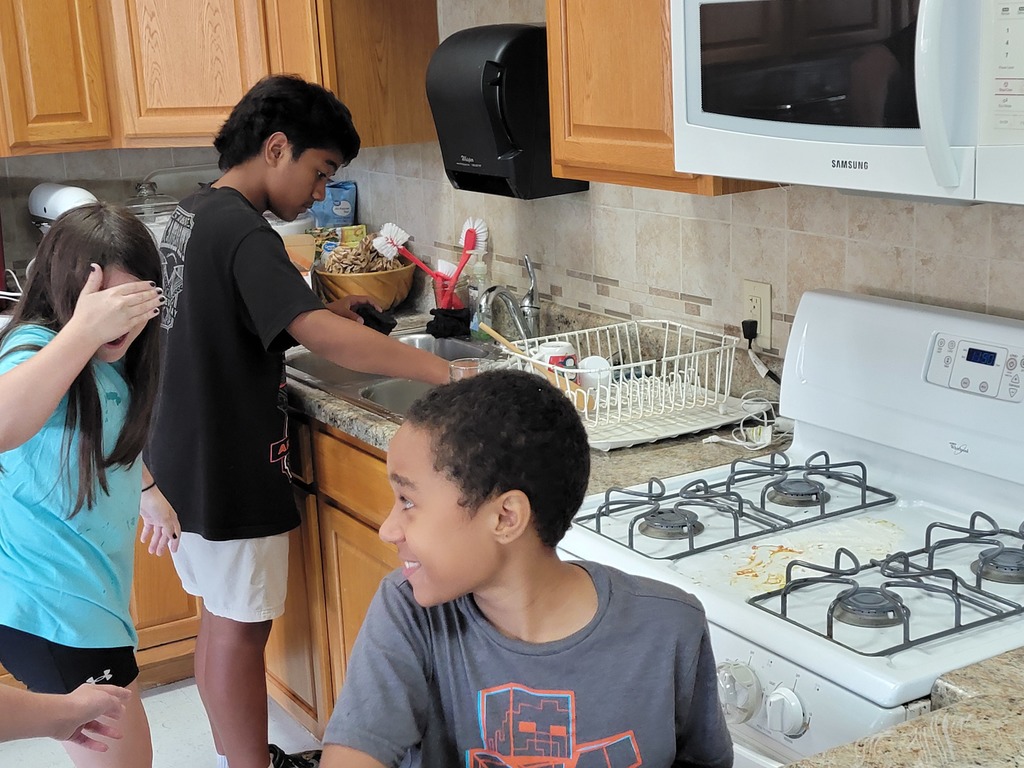 kids cleaning messy kitchen