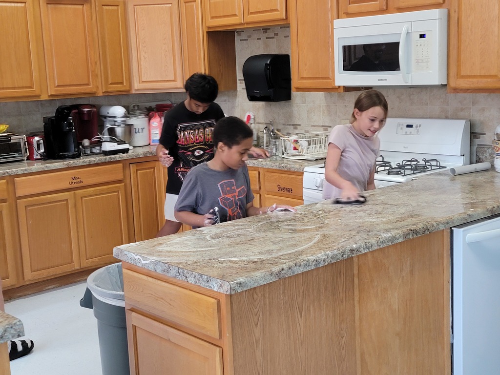 kids cleaning messy kitchen
