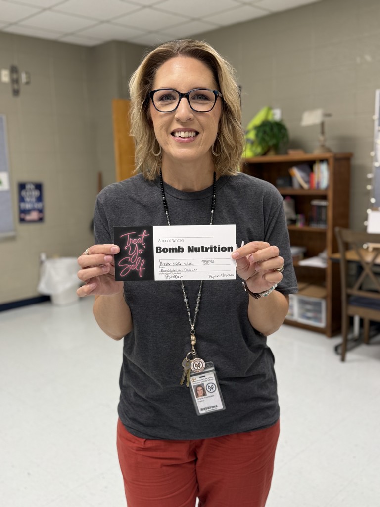 teacher holding gift certificate