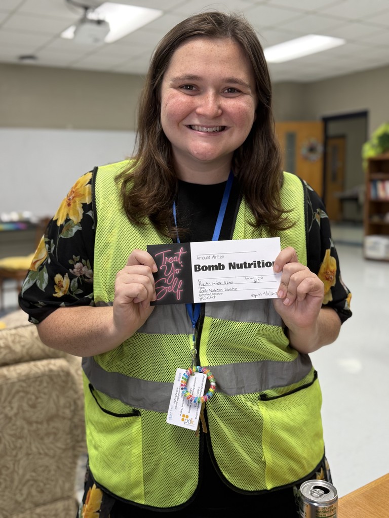 teacher holding gift certificate