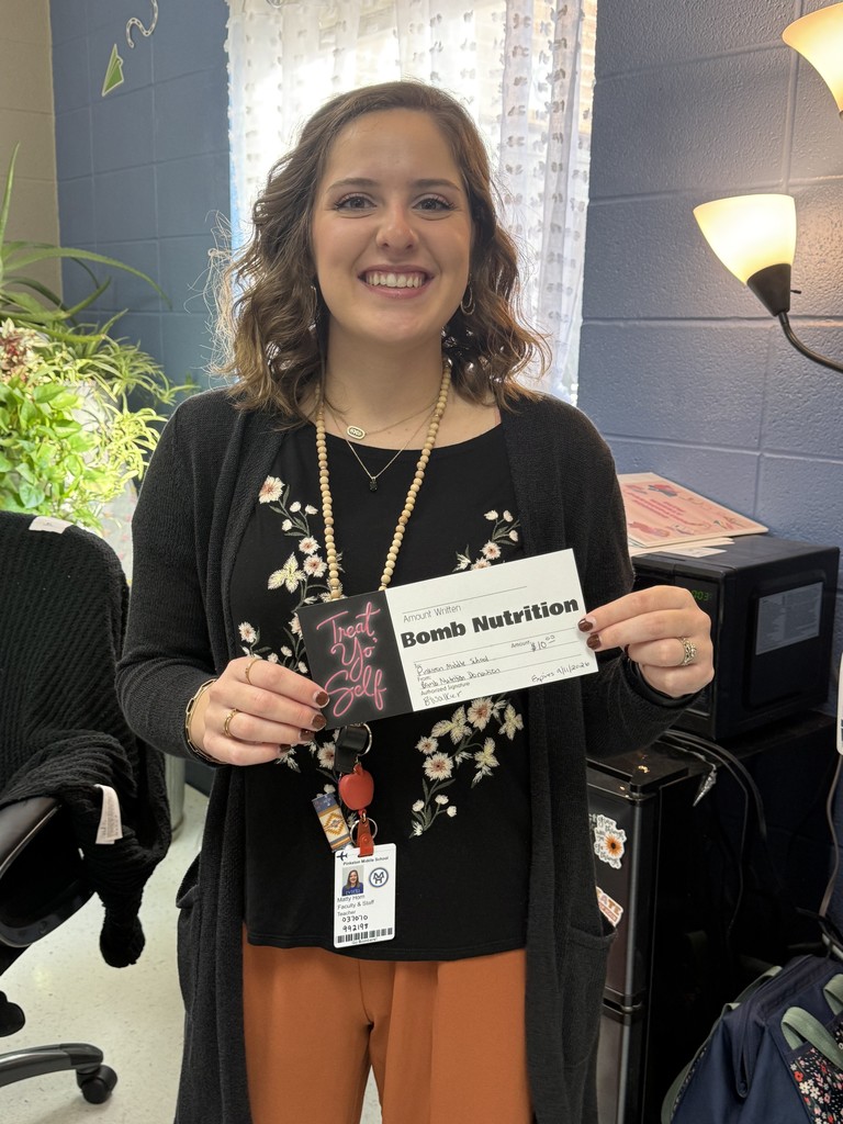 teacher holding gift certificate