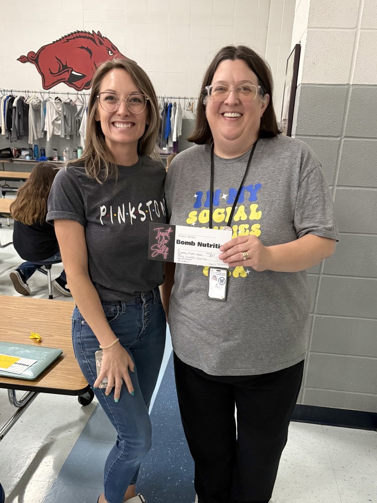 teacher holding gift certificate