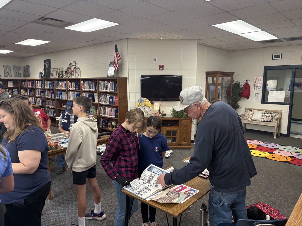 kids looking at a book