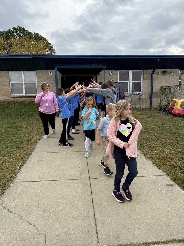 kids making an arch with arms