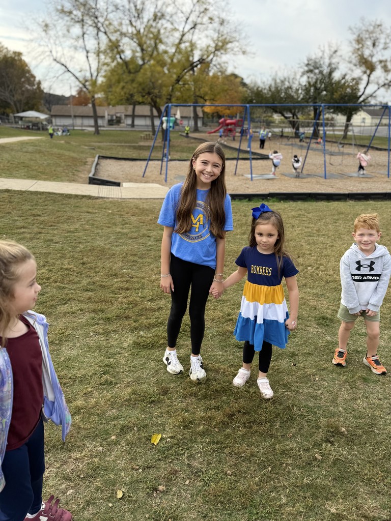 middle school girl on playground with elementary kids