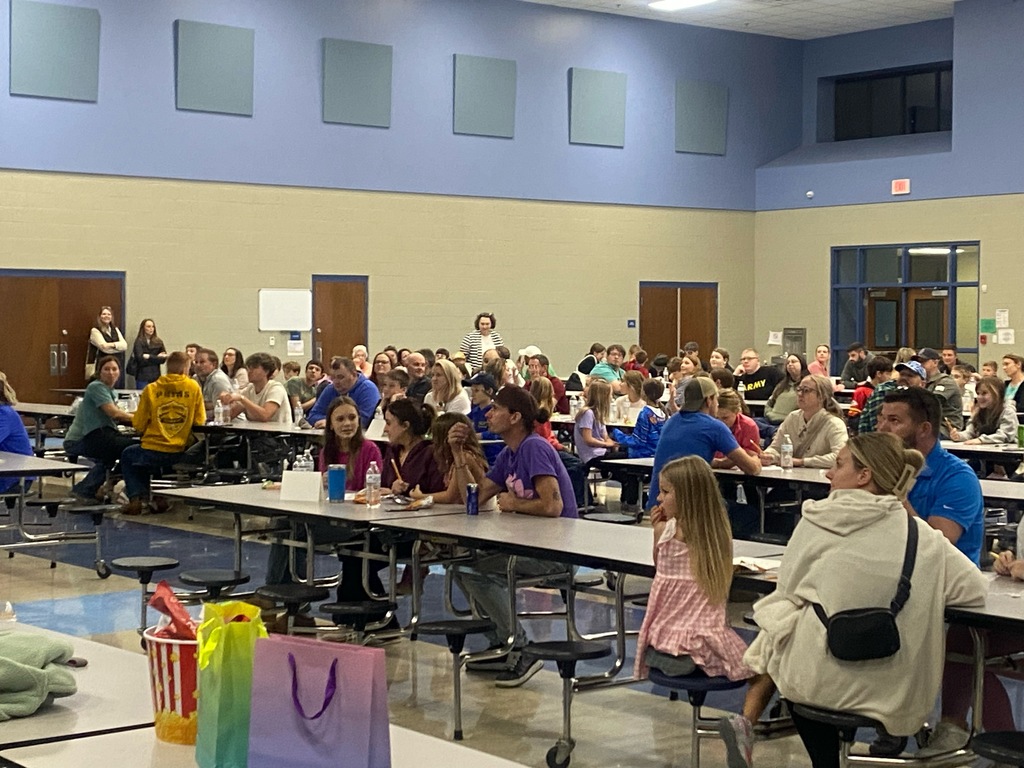 people playing trivia in the cafeteria