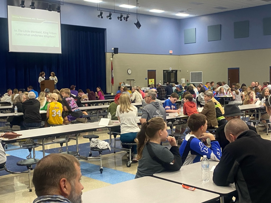 people playing trivia in the cafeteria