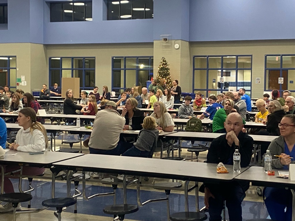 people playing trivia in the cafeteria