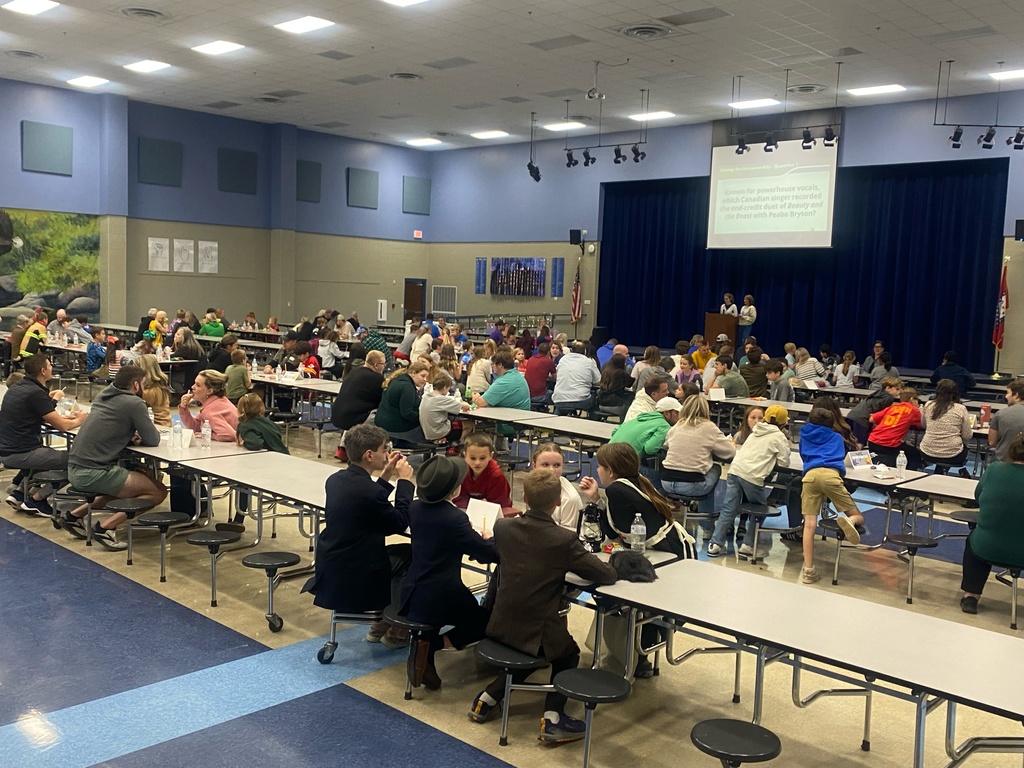 people playing trivia in the cafeteria