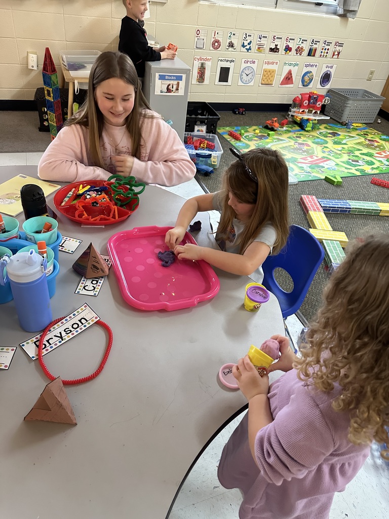 middle school kids with kindergarten students