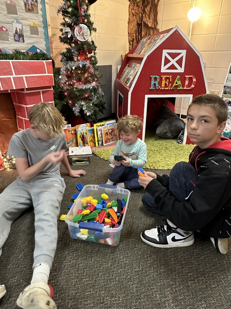 middle school kids with kindergarten students